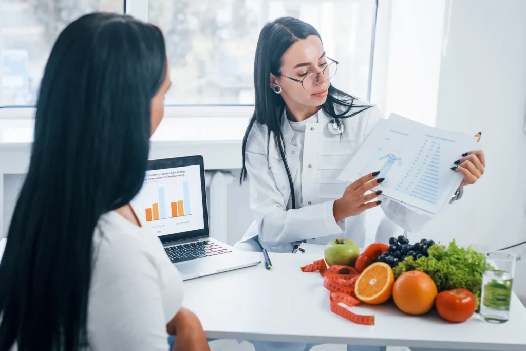 female nutritionist with laptop gives consultation 2025 03 18 21 22 59 utc